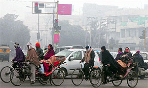 It was a hazy afternoon in Jalandhar on Wednesday with day temperature dipping and residents wrapping themselves in woollens