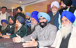 Jatinderpal Singh Saluja (second from right) and his supporters address a press conference in Ludhiana on Wednesday