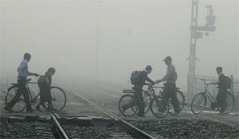 Commuters at a rail crossing in Jalandhar on Wednesday.