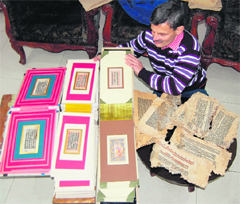 Rajnish Khosla with the treasure of ancient manuscripts at his house in Amritsar.