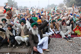 Members of the BKU (Lakhowal) stage a dharna on the railway track near Bathinda railway station on Thursday. 