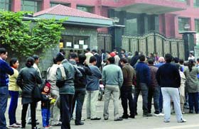 Parents queue up to collect forms at Queen Mary School in New Delhi