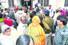 The police enquires with local people at the district hospital regarding the firing on a Samajwadi Party leader in Haridwar. 