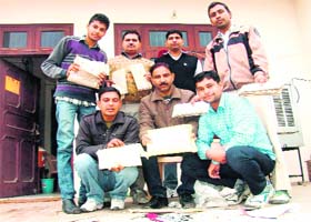 Members of the Shaheed Bhagat Singh Youth Club with speed post letters found lying in a bag near Ding Road in Sirsa