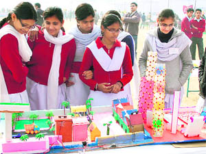 Students interact with visitors during a science exhibition at the SCERT in Gurgaon.