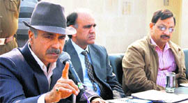 Gurgaon HUDA Administrator Praveen Kumar addresses a news conference in Gurgaon. 