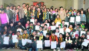 Position-holders in the All-India Ashihara Karate Championship held in West Bengal recently with their medals and certificates at the Ludhiana railway station.