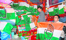 A shopkeeper sells flags of various political parties in Amritsar. 
