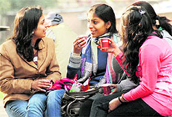 Students sip coffee to beat the chill at Student Centre in Punjab University, Chandigarh, on Friday