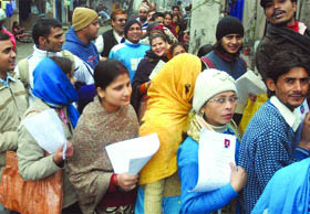 Parents que up to submit forms for nursery admission for their children at Siddharth International Public School in east Delhi on Friday. 