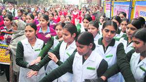 Women take a mass pledge against female foeticide organised by the district administration in Karnal on Friday. 