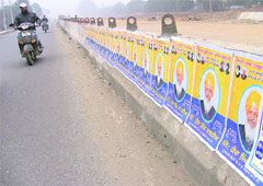 Posters in support of the SAD candidate from Atam Nagar constituency, Hira Singh Gabria, dot a median along the Sidhwan Canal expressway in Ludhiana. 