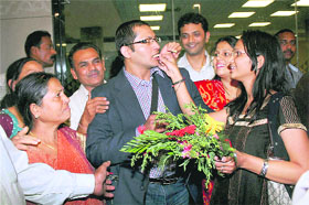A diamond trader being welcomed by his family at the Mumbai airport on Friday. 