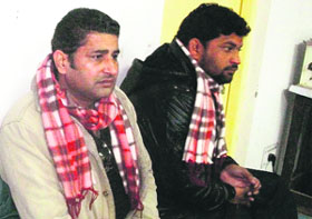 Kulbir Singh (left), personal security officer of a jeweller, in police custody in Mussoorie on Saturday.