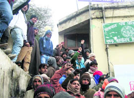 Members of the Shimla Nagrik Sabha hold a protest outside the office of the Managing Director of the HRTC at the Shimla bus stand on Saturday. 