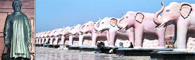 A statue of UP CM Mayawati and a row of elephants in stone