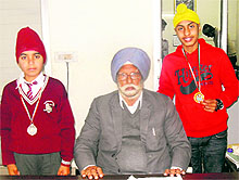 Two students of CS International School who won medals in a table soccer meet, at Mandi Gobindgarh