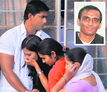 Friends of Anuj Bidve (inset) react after seeing his body at his Pune home on Saturday. 