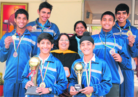 Members of the tennis team of DAV school, Sector 15, Chandigarh, with their trophies and medals.