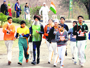 Marathon legend Fauja Singh runs with participants at Panchkula on Sunday.