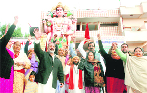Members of the VHP and Bajrang Dal protest against DP Dattana, chief executive official of Mata Mansa Devi Shrine, alleging him of misbehaviour with one of the priests at Hanuman Dham in Chandigarh on Sunday.