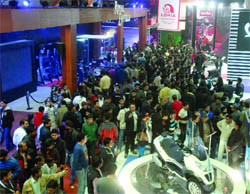 Visitors throng the 11th Auto Expo-2012 at Pragati Maidan, in New Delhi on Sunday. 