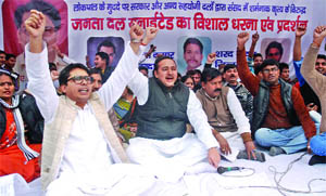 Activists of the Janata Dal (U) shout slogans during a demonstration in support of the Lokpal Bill at Jantar Mantar in New Delhi on Sunday. 