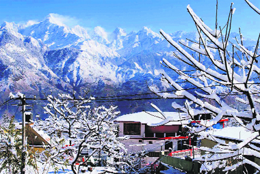 A view of Munisiyari town of Pithoragarh district after snowfall.