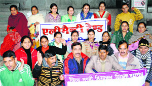 Teachers sit on a hunger strike under the banner of the Himachal Sikshak Sangh in Mandi on Sunday.