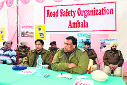 PK Mehta (right), Deputy Commissioner (Urban), with Vinod Kumar, ACP, Naraingarh, addresses a gathering at Shehzadpur on Saturday
