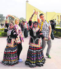 Pravasi Bharatiya Divas delegates dance with Rajasthani folk dancers at Jantar Mantar in Jaipur on Sunday. 