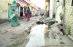 Sewerage water overflows on a road.