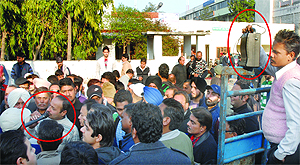 Congress councillor Rajinder Beri uses wireless microphone and speaker (marked in red circles) for making political announcements without seeking prior permission for the same from the District Electoral Officer at Congress Bhawan in Jalandhar on Sunday. Tribune Photo: Malkiat Singh