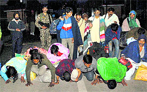 Indian prisoners kiss their home soil on their arrival at the Attari-Wagah international border on Sunday. As many as 180 Indians were released by the Pakistan government after completion of their jail terms