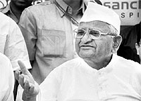 Social activist Anna Hazare talks to mediapersons after being discharged from hospital on Sunday