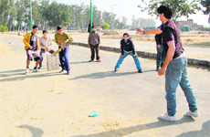 Youngsters play on a road in the absence of a playground in Bhaktanwala area in Amritsar.