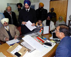 Former DGP PS Gill filling his nomination papers from Moga on Monday. 