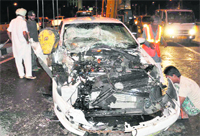 The mangled remains of a car that collided with a jeep on the flyover in Zirakpur.