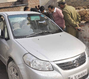 The police inspects an unknown car left by a notorious car thief, Banti, when the Faridabad police was chasing him at Nagala village in Faridabad. 