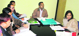 Nidhi Mani Tripathi, district election officer, Nainital, at a meeting with officials in Nainital on Monday.