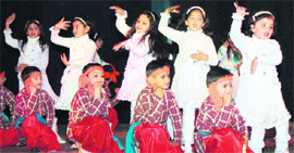 Students of May Fair Higher Secondary School perform a dance during the annual day function held at the Abhinav Theatre in Jammu on Monday.