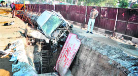 A car which fell into a ditch near Atam Nagar on the Ferozepur road, Ludhiana, on Monday. 