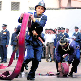 Firefighters display their skills during the annual fire drill competition in Mumbai on Monday. The drill, held every year, is aimed at enhancing the response of  the personnel to emergency situations.