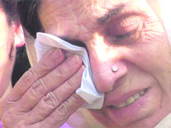 Surjit Kaur, wife of Capt Kanwaljit Singh, wipes her tears in Mohali on Monday