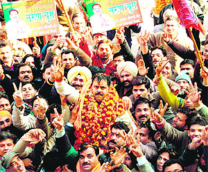 Tarun Chug, BJP candidate, along with his supporters on his way to file nomination papers in Amritsar on Tuesday.
