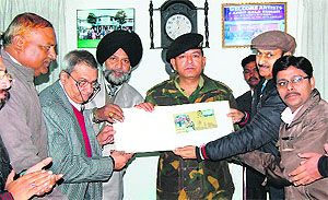 A special cover of the Retreat ceremony at the Attari-Wagah border being released at a philatelic exhibition at the SG Thakar Singh Art Gallery in Amritsar on Tuesday.