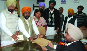 Congress candidate from the Bhucho Assembly constituency Ajaib Singh Bhatti files his nomination papers before ADC Bhupinder Singh, the returning officer, in Bathinda on Tuesday. 