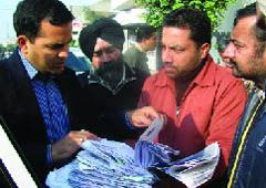 Deputy Commissioner KK Yadav verifying the enrolment of fresh voters in Bathinda on Tuesday. 