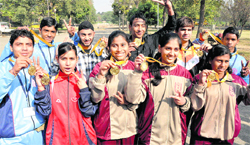 Winners of choi kwang do strike a pose with their medals during the National School Games in Chandigarh