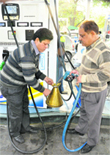 An official checks the quantity of diesel during a raid at the CITCO-run filling station in Sector 9 of Chandigarh
